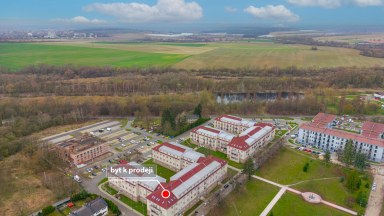 Prodej  podkrovního bytu 3+kk s parkovacím stání v Milovicích (okr. Nymburk)